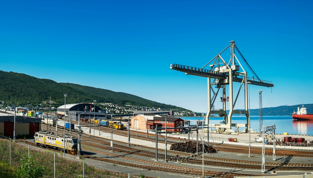 Narvik, Norway - July 28, 2018: Panoramic summer view of CargoNet Godsterminal Narvik, industrial iron ore port with cargo ship loader, crane and big containers in NorwayNarvik havn Narvik godsterminal